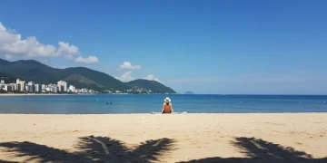 Pessoa desfrutando de exposição solar controlada em praia brasileira, otimizando vitamina D.